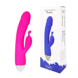 Pink vibracioni masažer sa procesom za stimulaciju klitorisa .