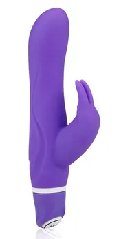 Ljubičasti silikonski vibrator sa stimulatorom klitorisa .