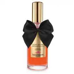 Разогревающее массажное масло light my fire с ароматом клубники и меда .