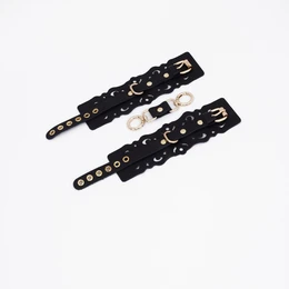 Lisice od crne kože sa uzorcima i zlatnim hardverom